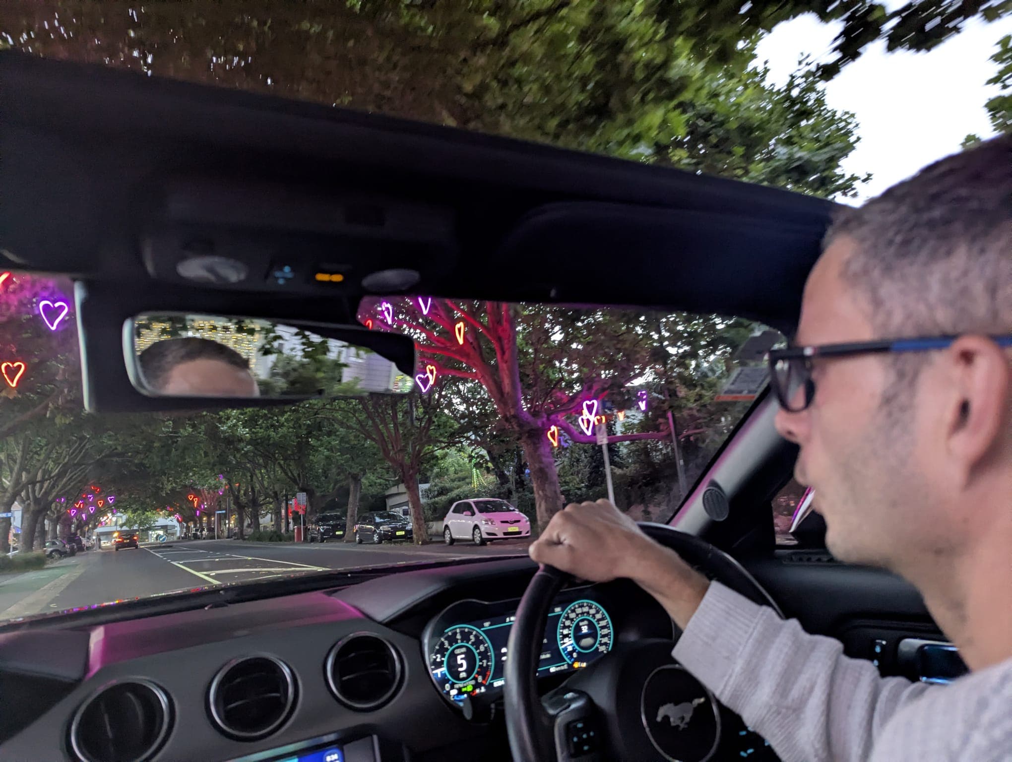 Tim Dyer driving through Auckland at dusk